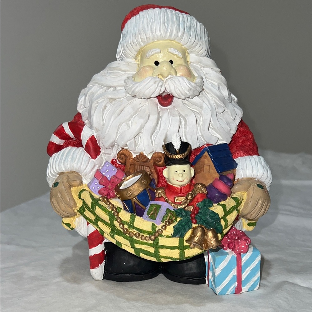 Festive Santa Claus Figurine with Gifts in Red, White, and Gold